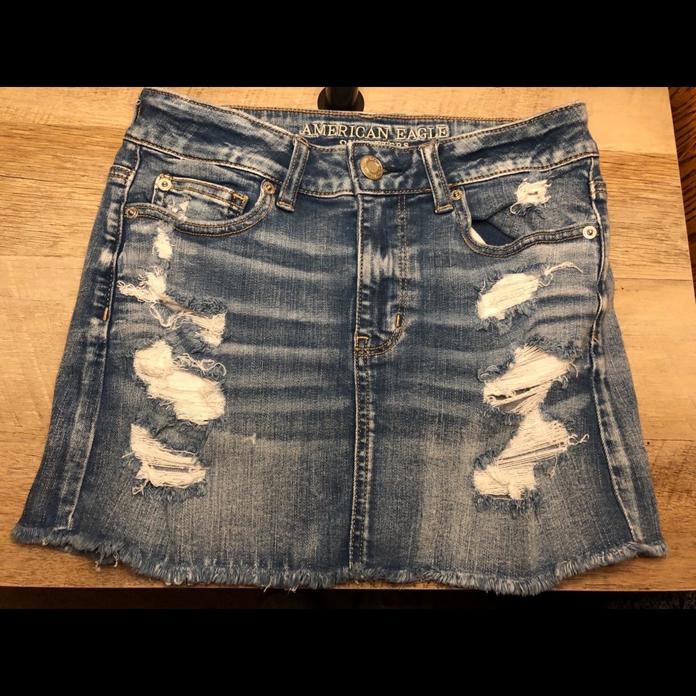 Denim distressed skirt.